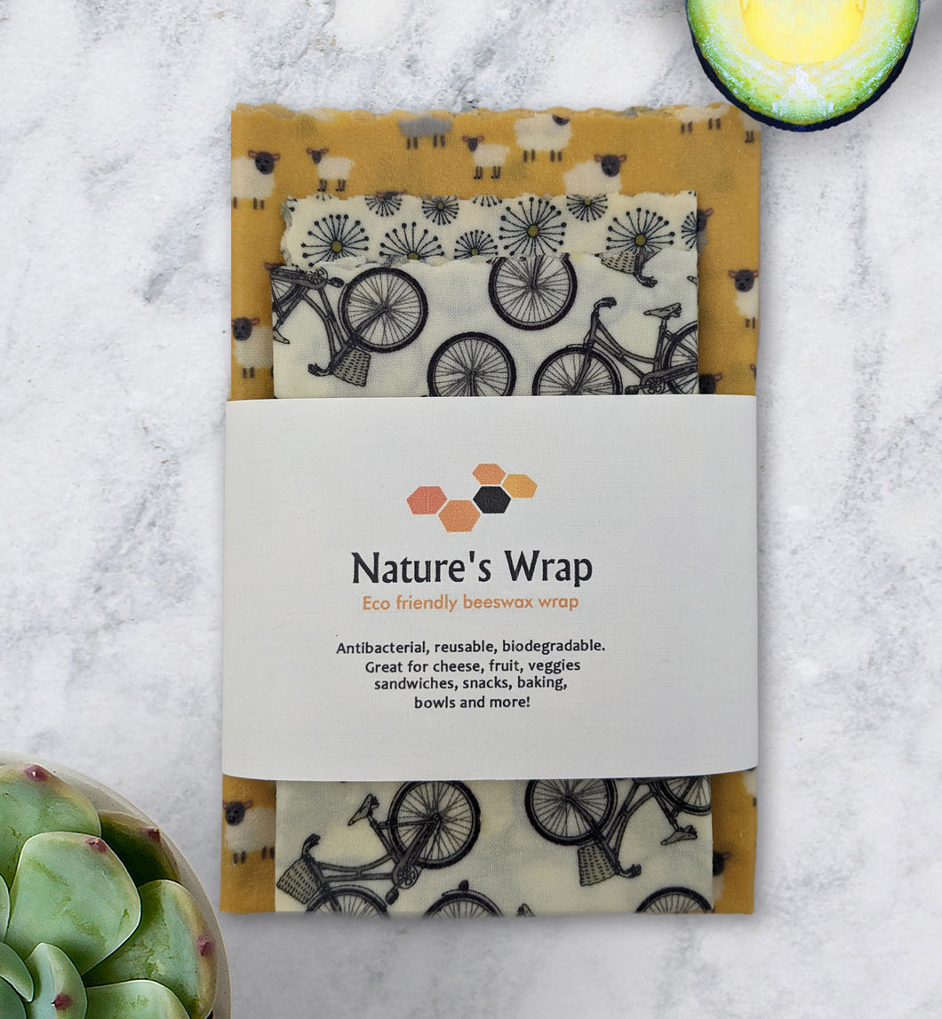 reusable beeswax food wraps set of three, eco friendly food storage , golden field of lambs, bikes and white flowers beeswax cloth